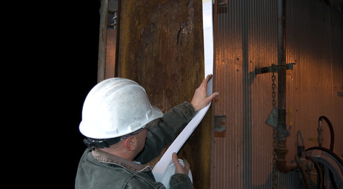 Albarrie's AlSeal Door Seal being installed